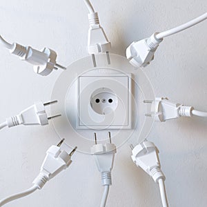 Many Electric Plugs are Fighting for Power from the Wall Socket Version 2