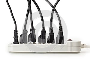 Many electrical cords connected to a power strip