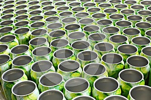 Many empty aluminum cans for drinks move on conveyor