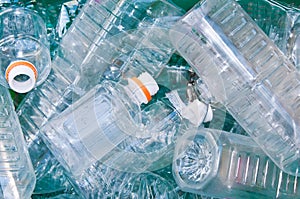 Many empty plastic bottles in trash for recycling