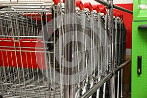 Many empty shopping carts in supermarket