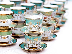 Many empty tea cups arranged for a coffee break.