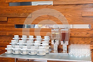 Empty White Tea Or Coffee Cups, Glasses and big Juice Bottles On The Table