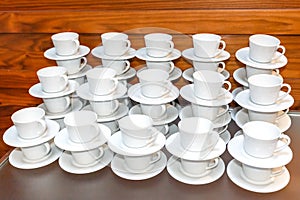 Many Empty White Tea Or Coffee Cups Stacked On Table. Event Catering Service