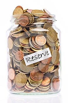 Many Euro coins in a jar as a reserve