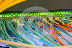 Many fiber optic cables connect to the central router interfaces. Optical Internet wires are in the server room data center. The