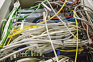 Many fiber optic cables in server room close up, modern internet technology