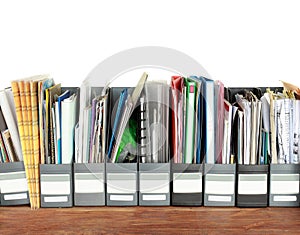 Many filing cabinets in an office