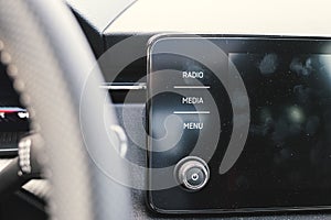 Many fingerprints on a touchable infotainment black screen interior car