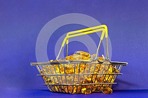 many of fish oil capsules stacked in a grocery basket