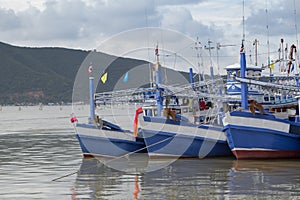 Many fishing boats on the ocean.