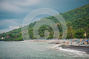 Many fishing boats on the ocean shore