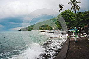 Many fishing boats on the ocean shore