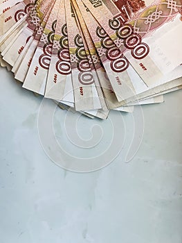 Many five-thousand-dollar bills lie in a fan. Banknotes with a face value of 5000 rubles.