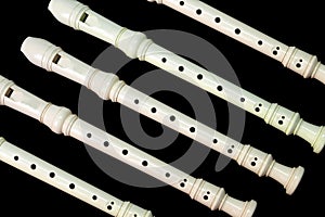 Many flutes isolated on black