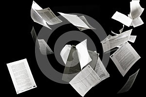 Many flying business documents isolated on black background