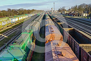 Many freight train wagons at the railroad station