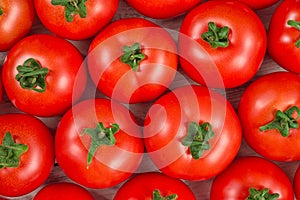 Many fresh red tomatoes background top view