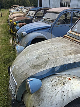 Many fronts of old vintage cars old grunge scratched dirty rusty vintage