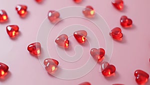 Many glass hearts on a pink background.