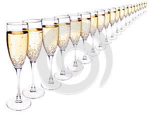 Many glasses of champagne in a row