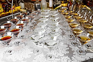 Many glasses of colorful Cocktails on the table