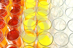 Many glasses with different juice. tableware for drinks