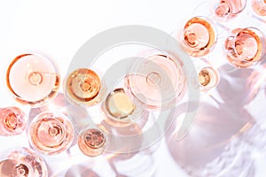 Many glasses of rose wine at wine tasting. Concept of rose wine