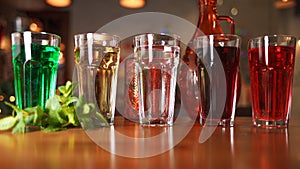 Many glasses with various natural lemonades in different colors