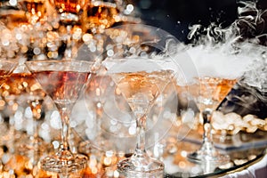 Many Glassware with Smoking Cocktail Beverage