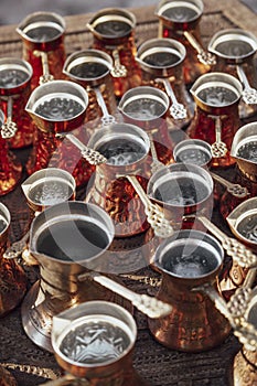 Many golden pots or kettles for Turkish coffee