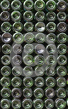 Many green glass wine bottles