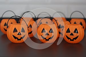 Many halloween pumpkins with scary faces looking forward