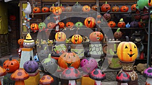 Many handcrafted fluorescent pumpkins made of clay