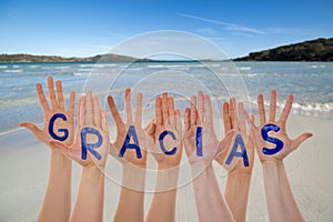 Many Hands Building Gracias Means Thank You, Beach And Ocean