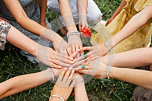 Many hands together: group of people joining hands. Teamwork