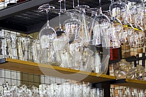 Many hanging glass goblets in the open bar. South of Russia, August