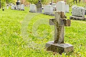 Many headstones in a cemetery