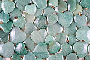 Green aventurine heart stones pile photo