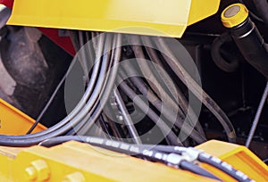 Many high-pressure hydraulic hoses for driving a loader on a tractor, industry