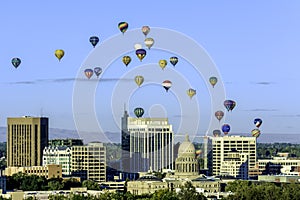 Many hot air ballons over the city of Boise Idaho