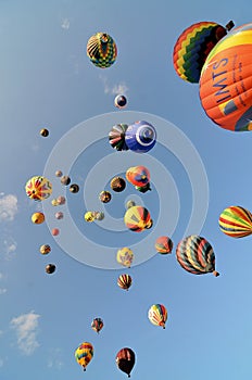 Many hot air balloons shortly after launching