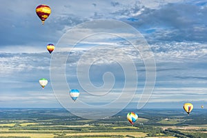 Many hot air balloons in the sky at blue sky with clouds background