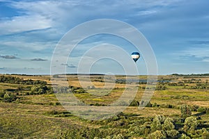 Many hot air balloons in the sky at blue sky with clouds background