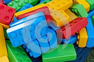 Many huge colorful toy bricks in heap