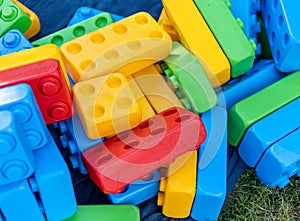 Many huge colorful toy bricks in heap