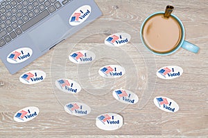 Many I Voted stickers on desk of hacker