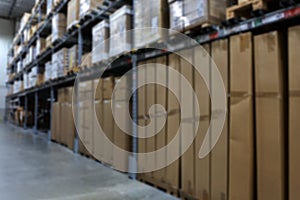 Many items inside cardboard boxes on warehouse storage shelves