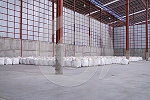 Many jumbo bags of rice are stored in the rice mill`s warehouse