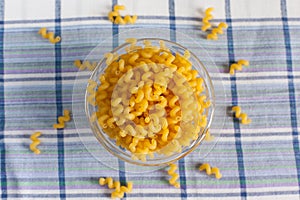 Many kinds of different pastes are exactly set out on a blue background.